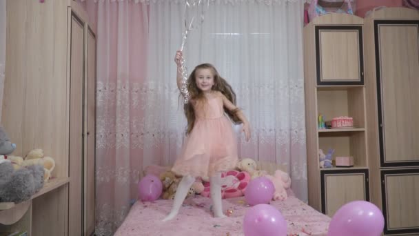 Little girl jumping with balls — Stock Video