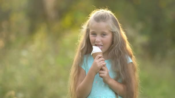 The girl is eating ice cream — Stock Video