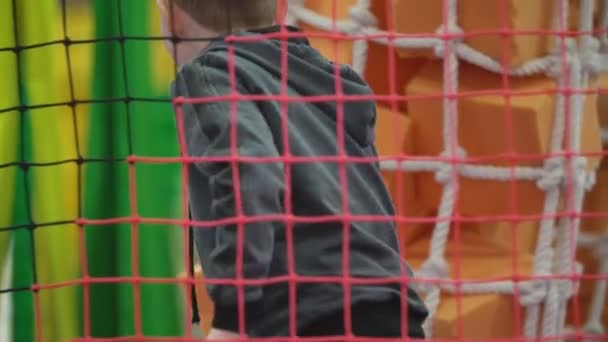 Boy playing on the playground — Stock Video