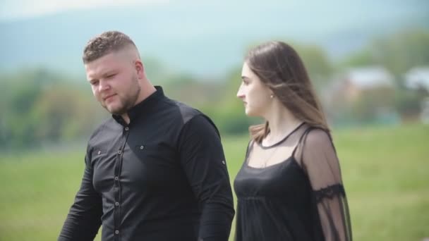 Young couple walking in nature — Stock Video