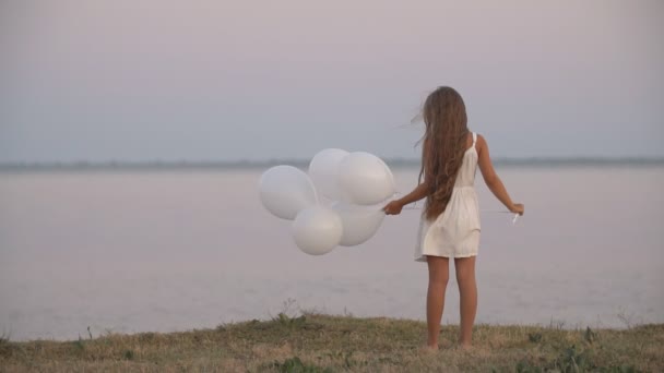 Girl with white balloons — Stock Video