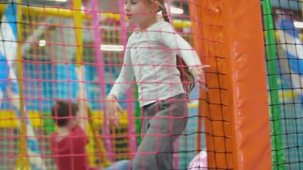 Girl is walking in the playroom — Stock Video