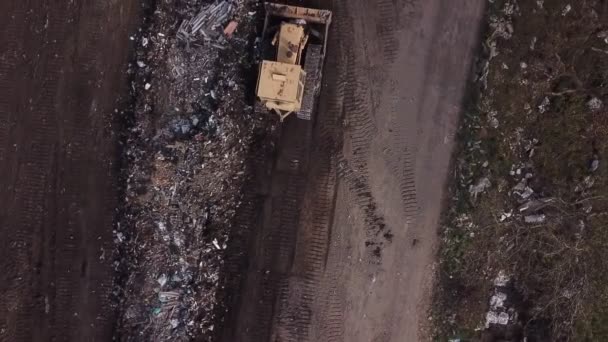 Bulldozer piling up garbage — Stock Video