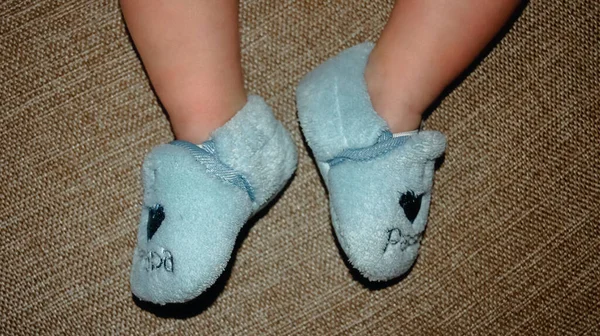 Baby Feet Booties Brown Background — стоковое фото