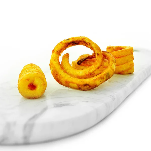 Нежелательная еда - Curly Fries — стоковое фото
