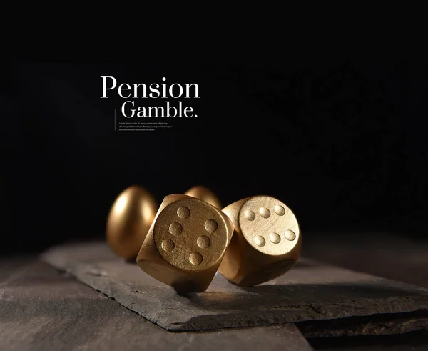 New and unique concept image created to represent pension and investments risks. Creatively lit image of two tumbling dice and gold pension eggs against a black background with copy space.