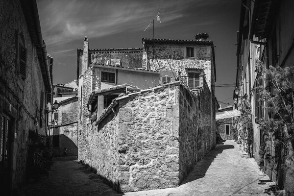 Valldemossa, Mallorca, Balearic Islands, Spain - July 21, 2013: View of the narrow streets of Valldemossa