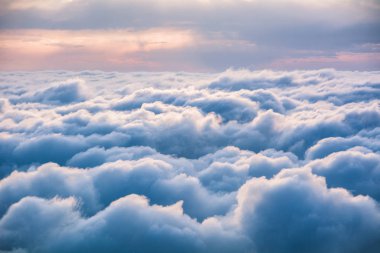 View of the clouds from above at dawn clipart