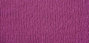 Dikişsiz örgü desen. Yünlü kumaş. Pembe, mor doku.