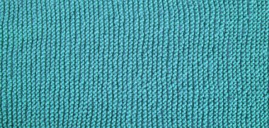 Dikişsiz örgü desen. Yünlü kumaş. Mavi, Turkuaz doku.
