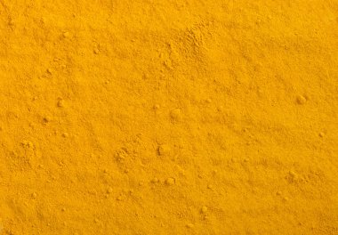 Zerdeçal tozu doku. Sarı curcuma baharat arka plan.