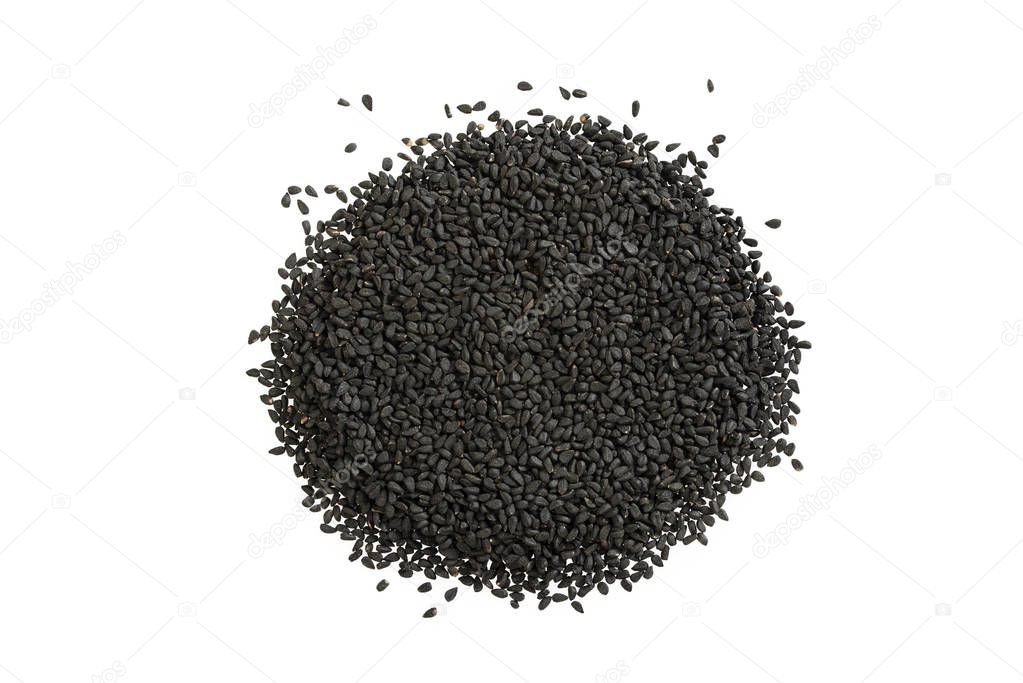 Black cumin heap on white background. A pile of nigella sativa seed.