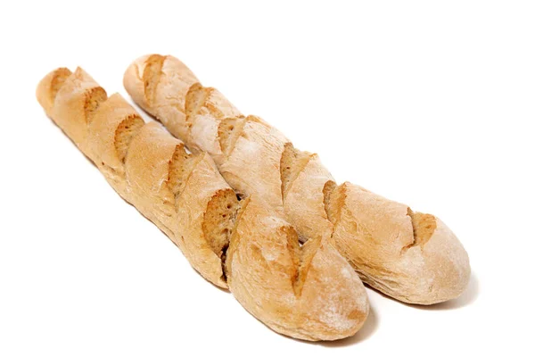 伝統的なバゲット パンの白い背景の上のビューを閉じます — ストック写真