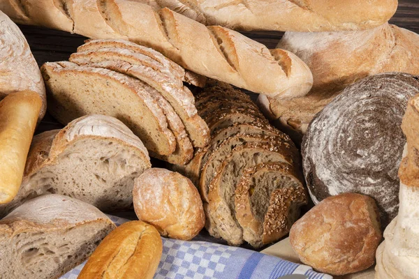 Fresh Assortment Several Baked Bread Varieties Wooden Table — Stock Photo, Image