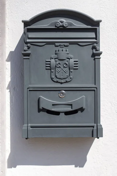 Close up view of a urban wall mailbox.