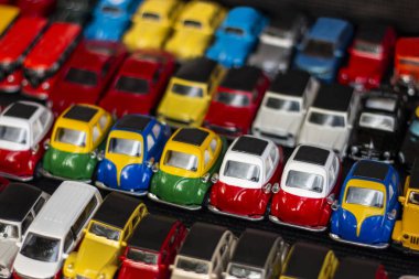 Arrangement of miniature car toys on a local shop. clipart