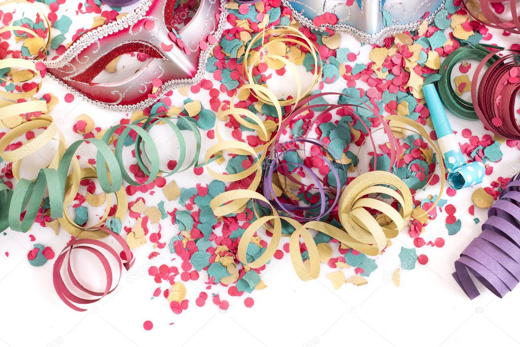 carnival venetian masks with confetti and serpentine streamers.