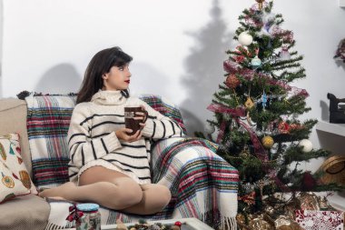 Young girl on sofa at christmas