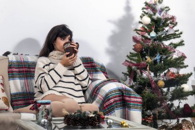 Young girl on sofa at christmas