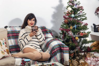 Young girl on sofa at christmas