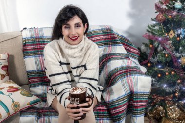 Young girl on sofa at christmas