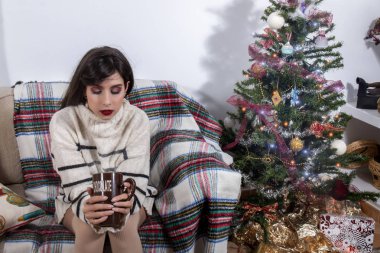 Young girl on sofa at christmas