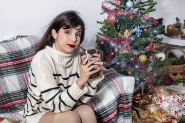 Young girl on sofa at christmas