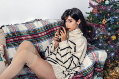 Young girl on sofa at christmas
