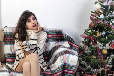 Young girl on sofa at christmas