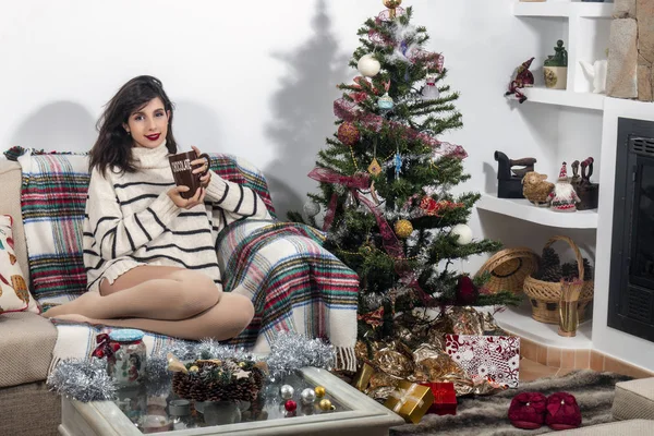 Young girl on sofa at christmas — Stock Photo, Image