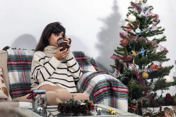 Young girl on sofa at christmas