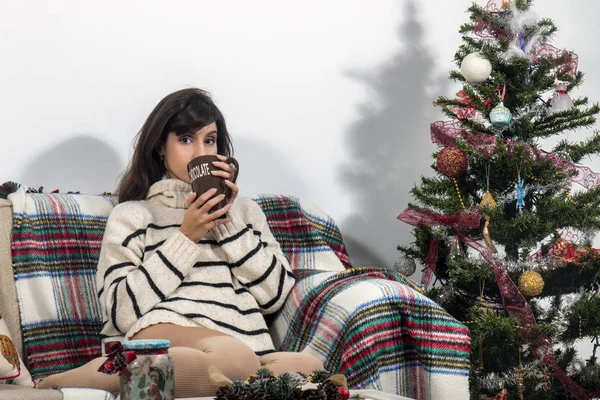 Young girl on sofa at christmas