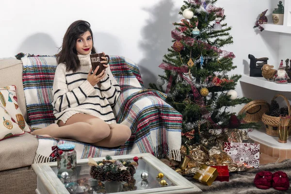 Young girl on sofa at christmas