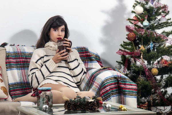 Young girl on sofa at christmas