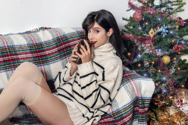 Young girl on sofa at christmas