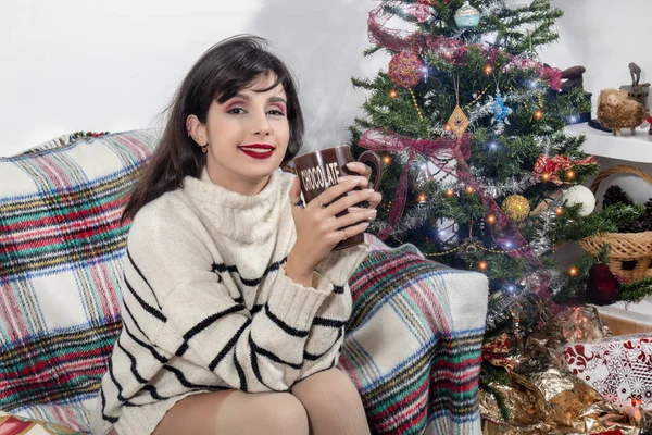 Young girl on sofa at christmas — Stock Photo, Image