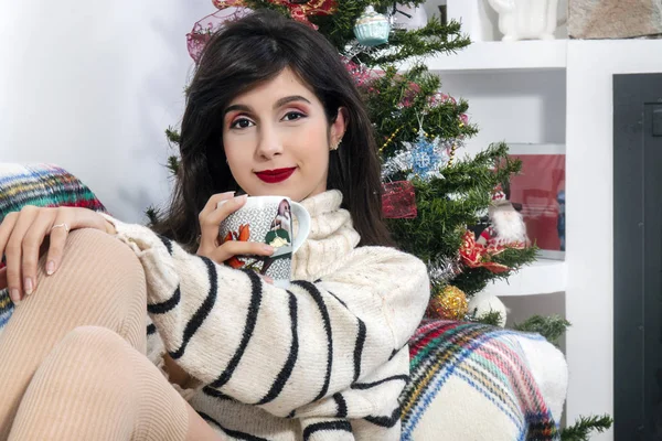 Young girl on sofa at christmas