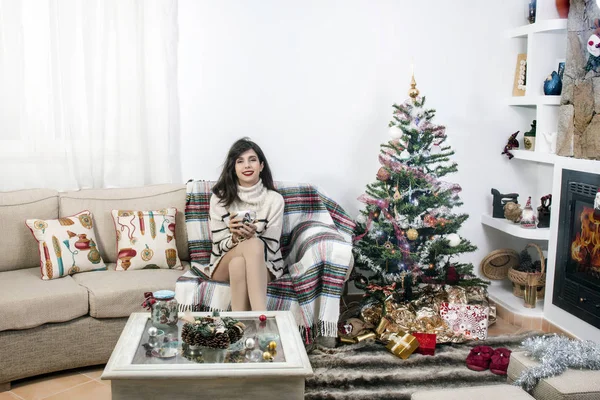 Young girl on sofa at christmas