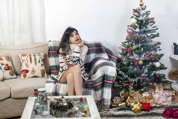 Young girl on sofa at christmas