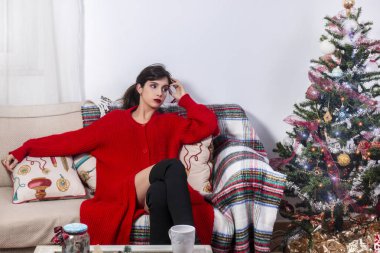 Young girl on sofa at christmas