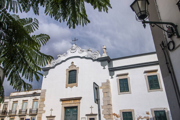 View of the historical Church of Nossa Senhora Pe da Cruz located on Faro, Portugal.