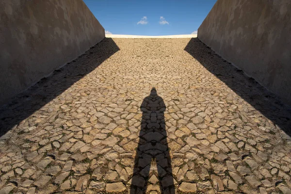 Shadow of man on a stone ramp — Stock Photo, Image