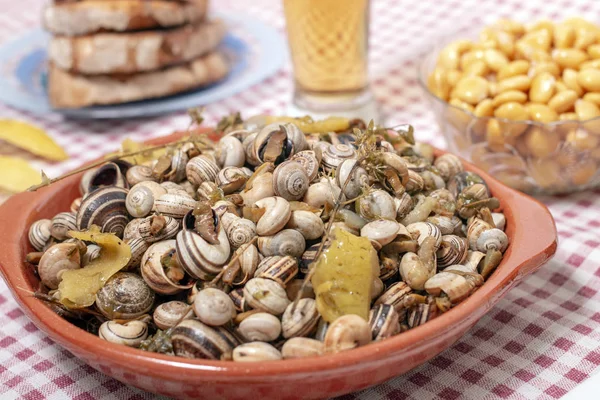 Traditional dish of cooked snails — Stock Photo, Image