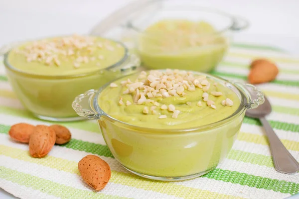 Fresh Sweet Avocado Pear Cream Dessert Little Pieces Almond Top — Stock Photo, Image