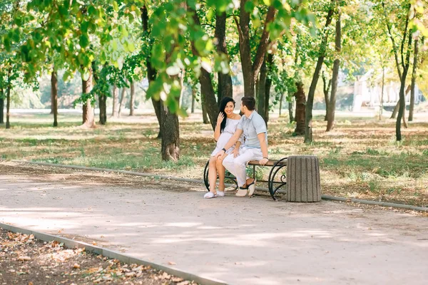 Young Guy His Pregnant Girl Sitting Bench Background Greenery Trees — Stock Photo, Image