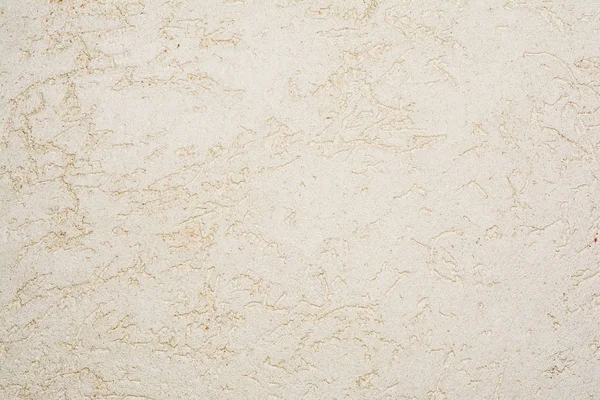 The texture of the surface of the ancient wall covered with decorative plaster of the woodworm type, close-up architecture abstract background — Stock Image Texture Surface Ancient Wall Covered Decorative Plaster Woodworm Type Close Stock Image