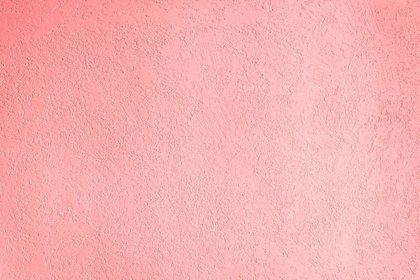 The pink texture of the surface of the wall covered with decorative plaster of the woodworm type, close-up architecture abstract background — Stock Image Pink Texture Surface Wall Covered Decorative Plaster Woodworm Type Close Stock Photo