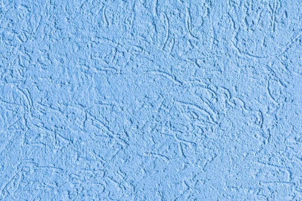 The blue texture of the surface of the wall covered with decorative plaster of the woodworm type, close-up architecture abstract background — Stock Image Blue Texture Surface Wall Covered Decorative Plaster Woodworm Type Close Stock Picture