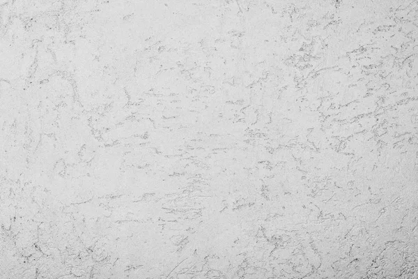 The gray texture of the surface of the wall covered with decorative plaster of the woodworm type, close-up architecture abstract background — Stock Image Gray Texture Surface Wall Covered Decorative Plaster Woodworm Type Close Royalty Free Stock Photos