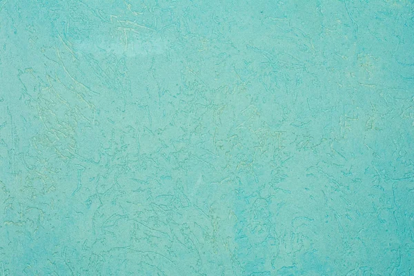 The green texture of the surface of the wall covered with decorative plaster of the woodworm type, close-up architecture abstract background — Stock Image Green Texture Surface Wall Covered Decorative Plaster Woodworm Type Close Stock Picture